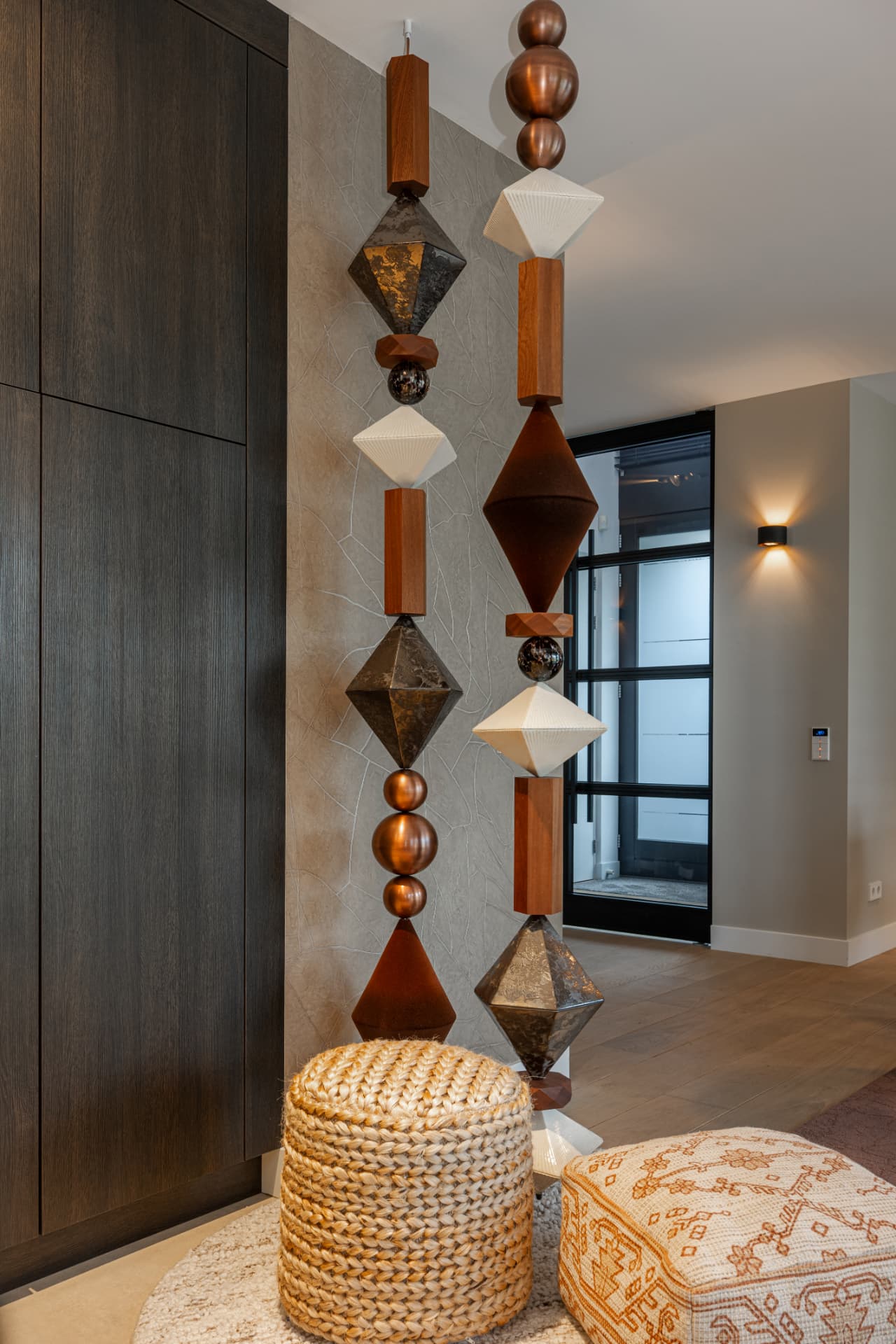 Copper, ceramic and wood BigBeads strands beside oak cabinetry